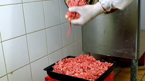 butcher making minced in meat mincer machine 4k