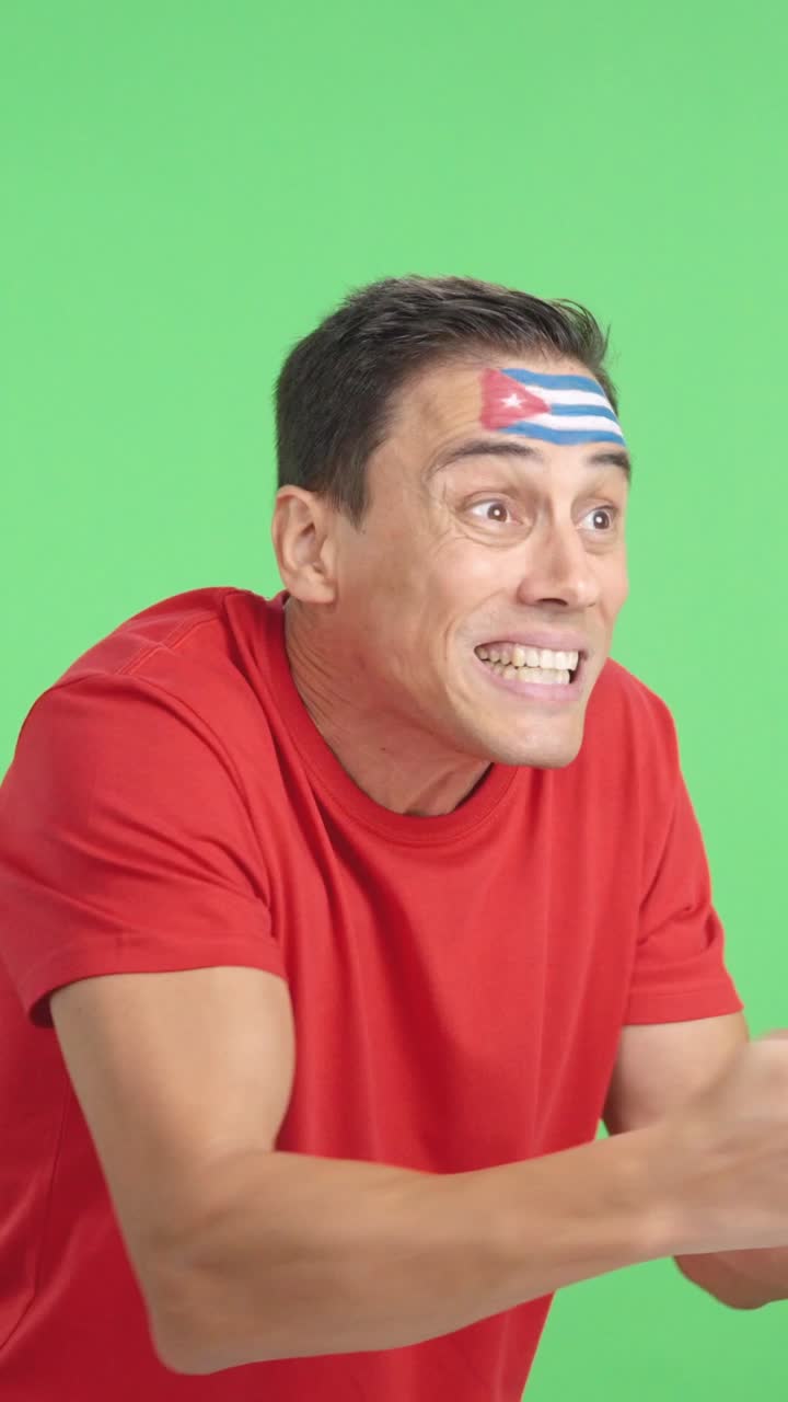 Man cheering for Cuba, angry with the decision of referee