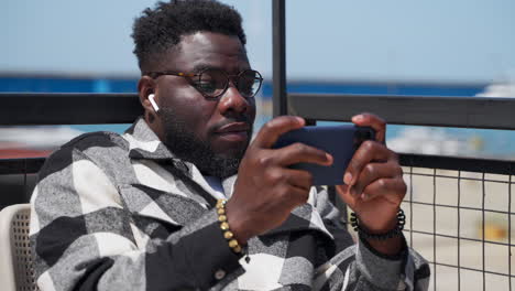 man using smartphone outdoors