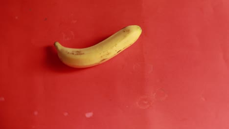 bananas-rotate-in-a-circle-isolated-on-red-background