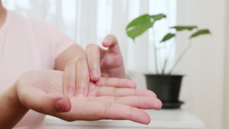 close up of women palm acupressure self-massage by her hand