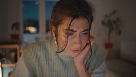 worried freelancer finding mistake late apartment closeup. lady looking computer