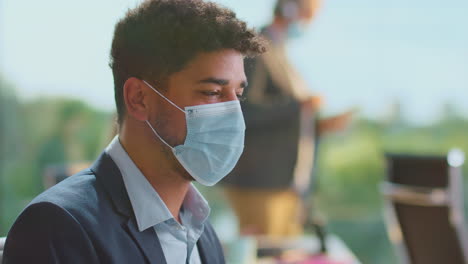 man wearing mask in office