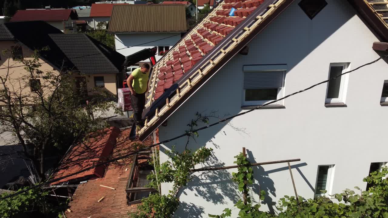 Workers working building rooftop