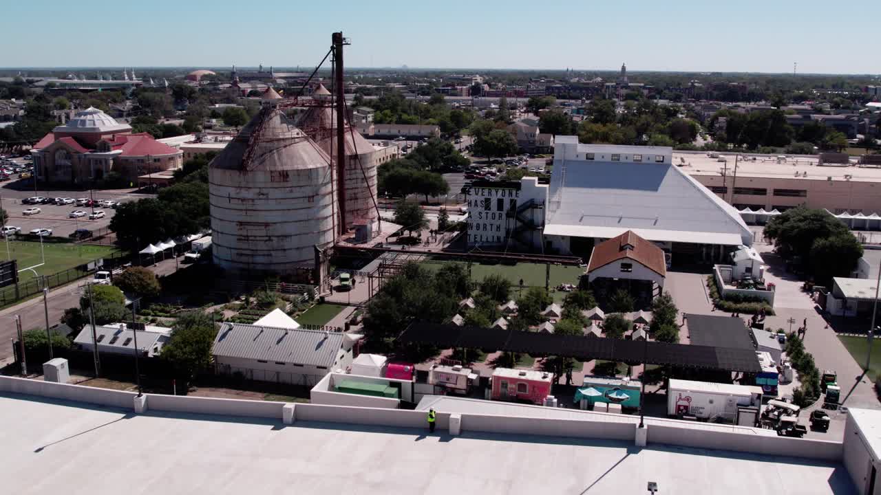 4K drone parallax footage of the silos market in downtown Waco, showing the landmark, streets, and urban buildings with smooth cinematic motion
