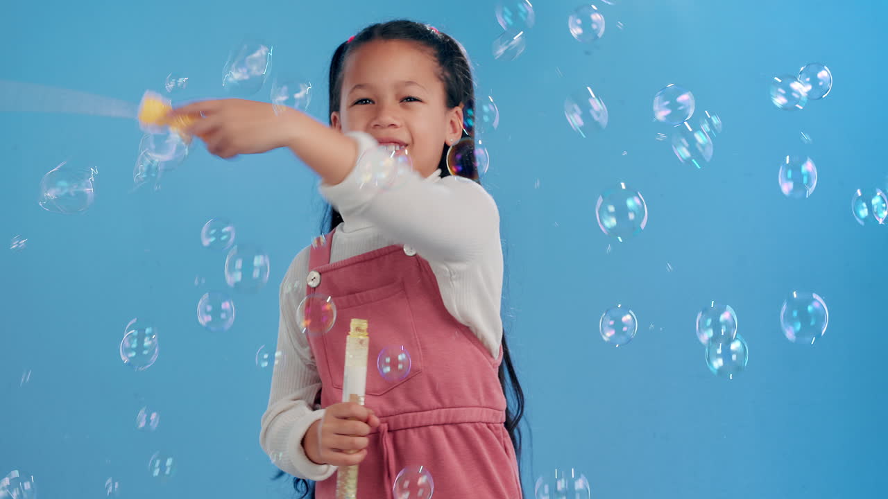 Girl playing with bubbles