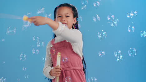 girl playing with bubbles