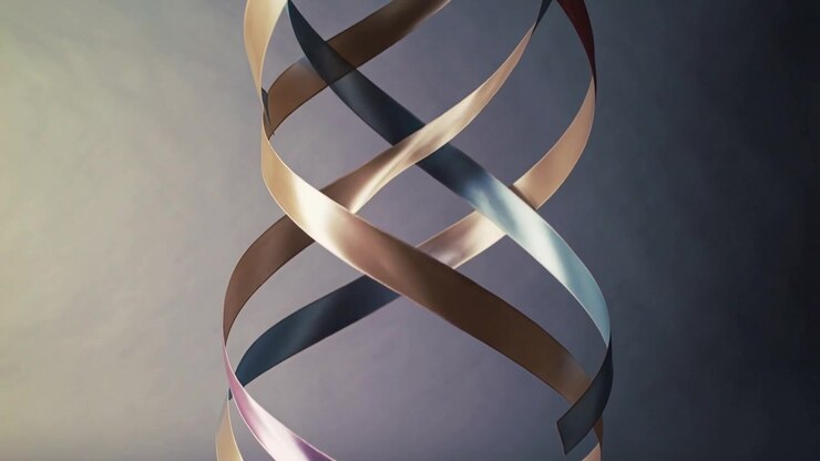 Camera panning revealing ribbon helix in studio, showing three satin metallic ribbons for gleam