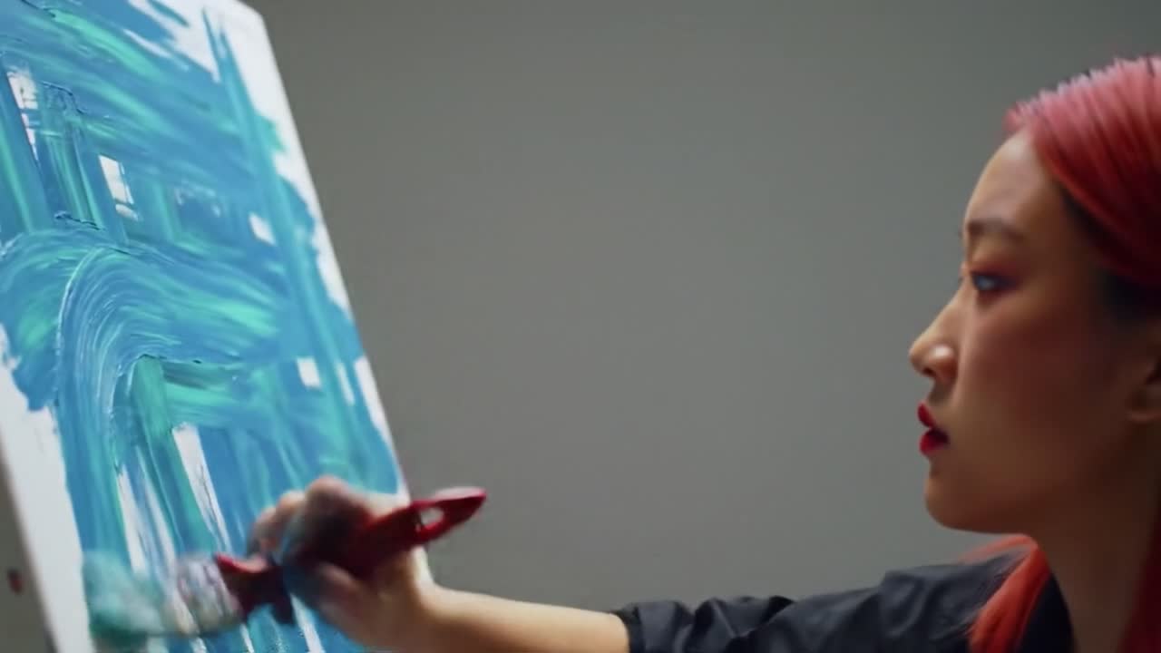 A talented artist passionately works on a colorful mural in an urban studio. The late afternoon light creates an inspiring atmosphere as she carefully applies paint to the canvas.