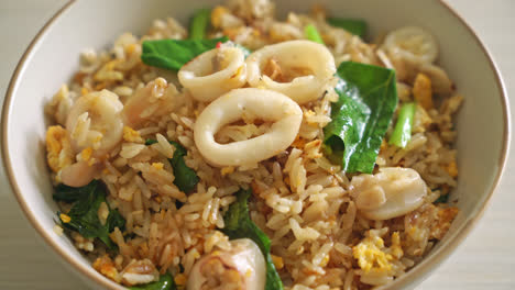 fried rice with squid or octopus - stir-fried rice with squid, egg and kale