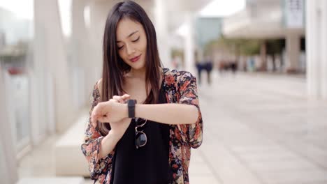 young woman checking her wristwatch