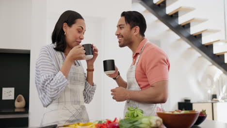 Happy-couple,-cooking-and-conversation-with-drink