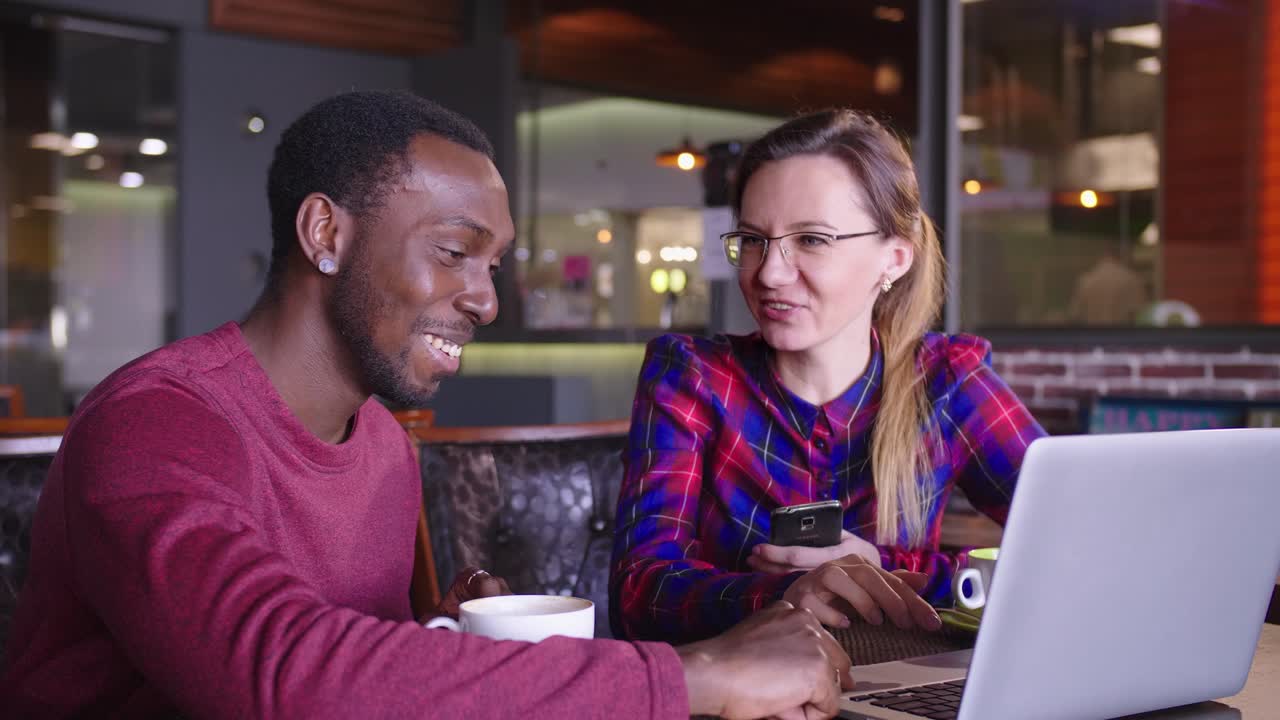 Business Colleagues Working Together at a Cafe