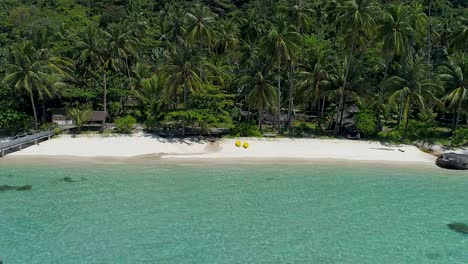 revealing aerial shot of a perfect tropical private beach in asia