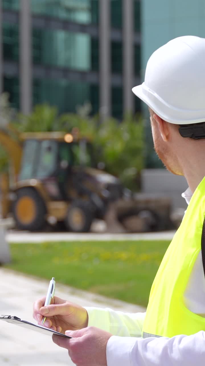 Construction Worker on Site with Excavator