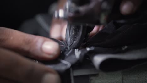 Leather-Gloves-Stitched-On-Sewing-Machine-By-Sweatshop-Factory-Worker
