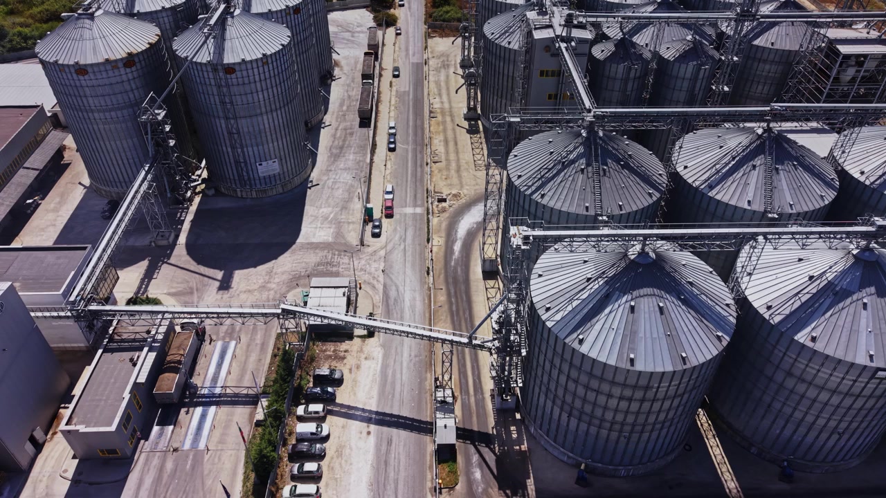 View of a grain storage facility with silos and buildings in the area