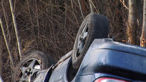 car accident on the slippery roads with black ice turned upside down