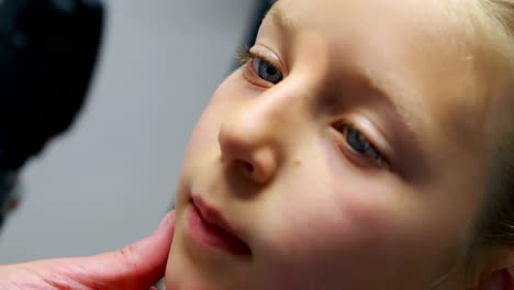 male doctor examining patient eye