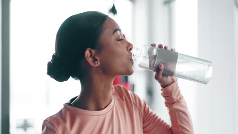 woman, drinking water and fitness in gym