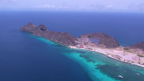 Aerial-view-Vibrant-Island-Life-Bathed-in-Tropical-Splendor,-pan-right