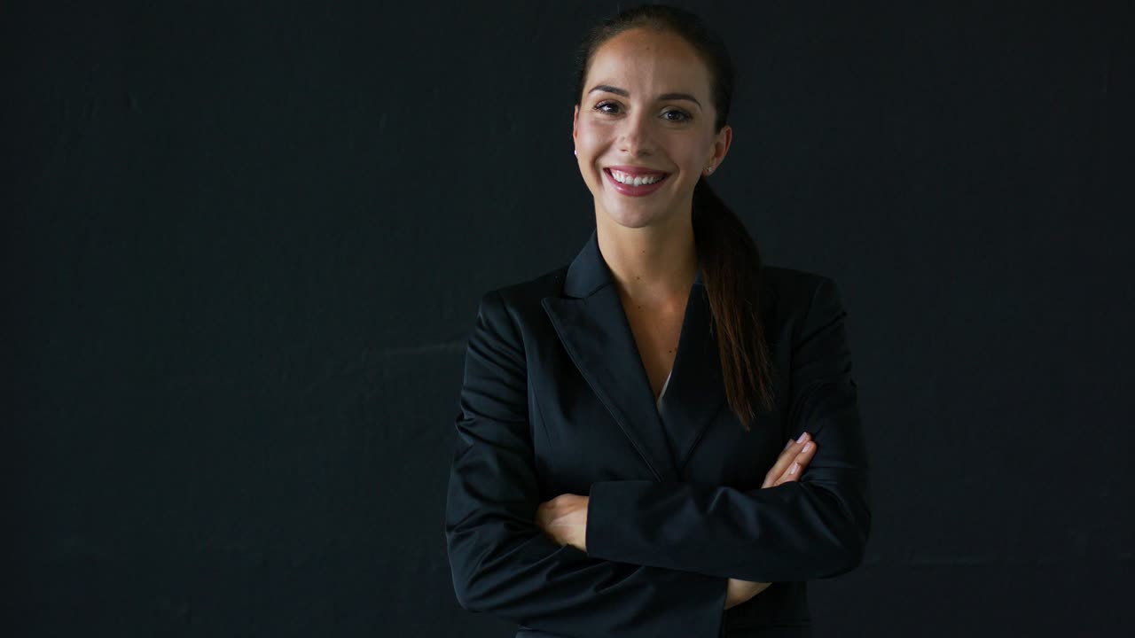 Young businesswoman with crossed arms