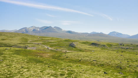 bright green rocky mountain landscape of the rondane national park in norway -wide