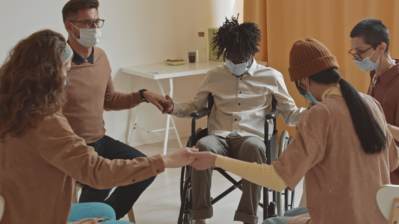 Support Group Session with Diverse Individuals Wearing Face Masks