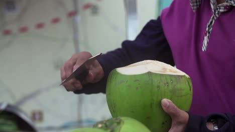 coconut chopped open and ready to be served as beverage