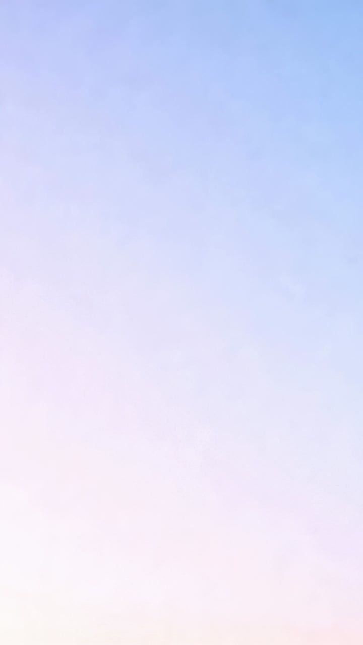 Vertical video: Playback starting, sky-color gradient holding steady in open sky to convey calm