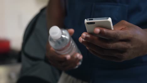 Man-using-mobile-phone-at-home