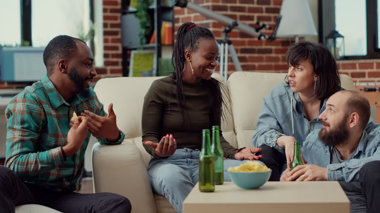 Diverse people laughing together and drinking beer