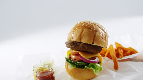 Hamburger-and-french-fries-on-table