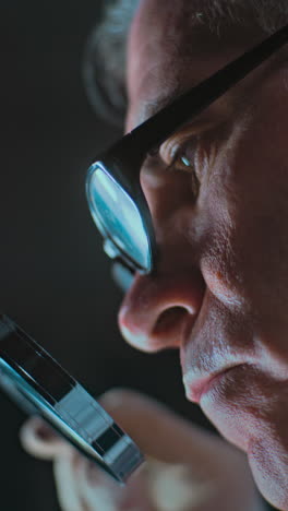 man examining with magnifying glass