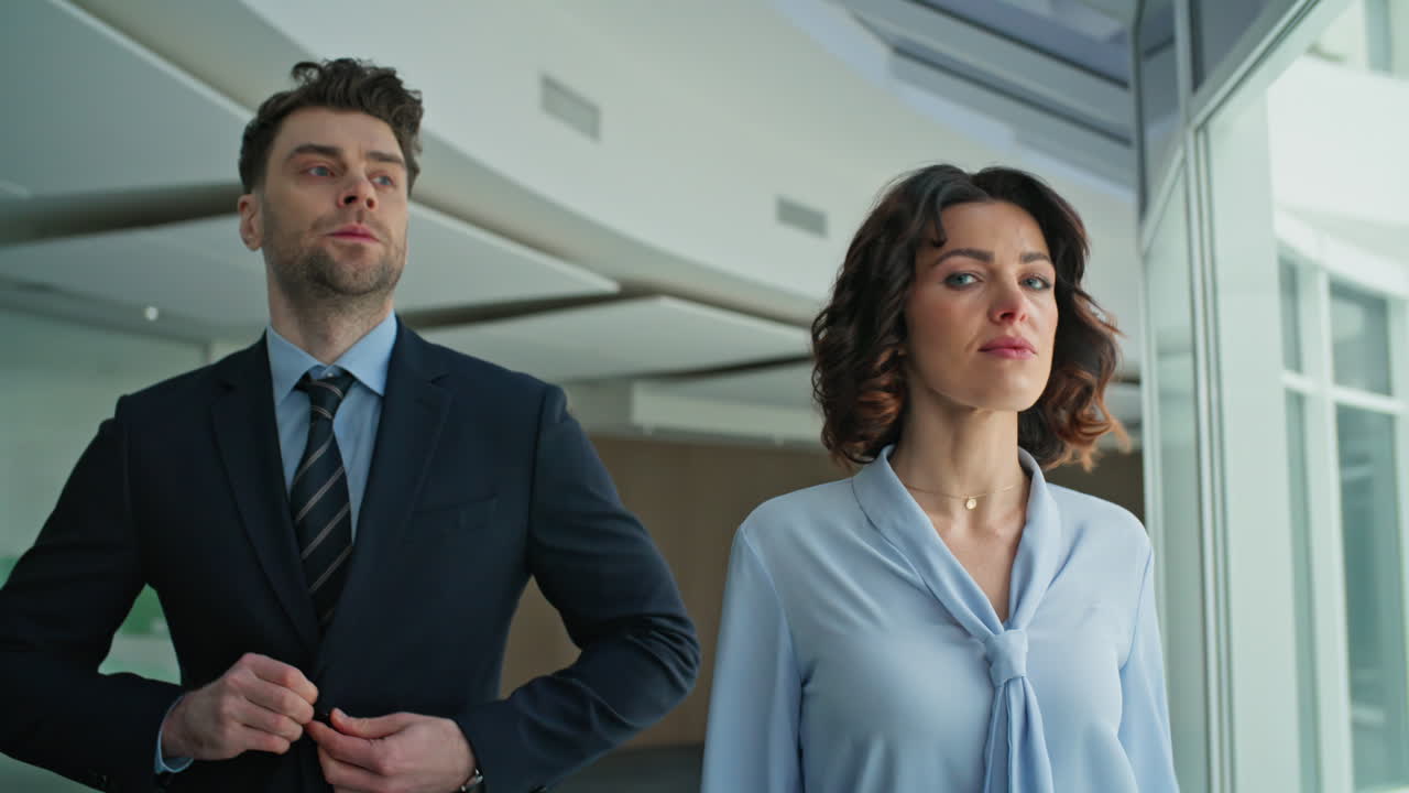 Confident business partners walking office hallway closeup. Successful managers