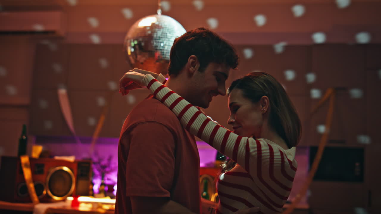 Happy lovers dancing party in empty apartment close up. Romantic couple date