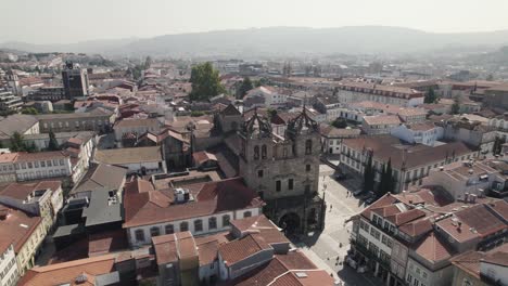 aerial backwards view of the romanic cathedral in the historic center of braga