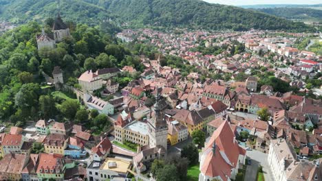 Sighisoara-Old-Town-in-Transylvania,-Romania---Aerial-4k-Circling