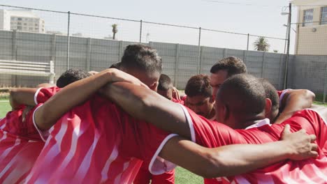 soccer players motivating on field