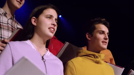 teenagers rehearsing in a theatre