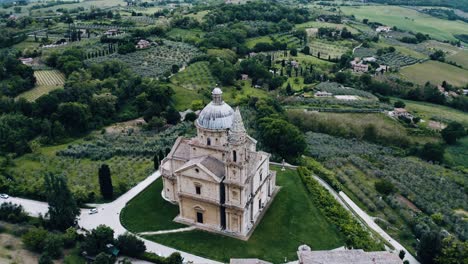 Rising aerial view over Italy&#039;s Sanctuary of the Madonna di San Biagio to reveal Italy&#039;s lush countryside