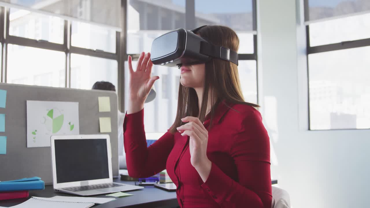 Businesswoman using VR headset in modern office
