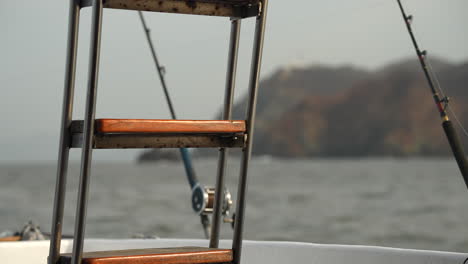 deep sea fishing on a boat in rough seas on an overcast gloomy day near some islands in mexico, motion sickness, bounce, swells, big waves