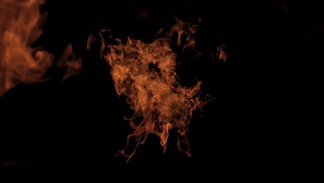 dying fire in slowmotion, real fire and flame disappearing slowly isolated on black background 4k video element