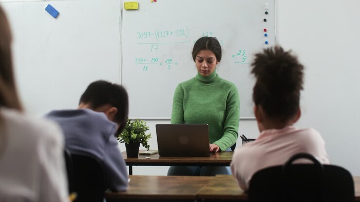 Teacher and students at school