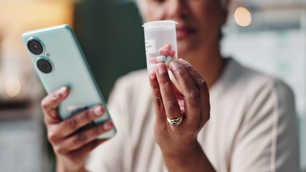 Woman holding medication and phone