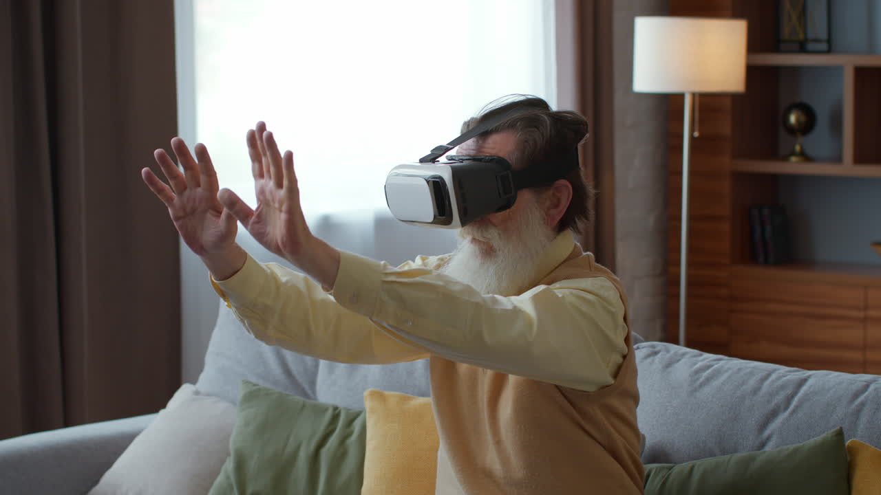Senior man experiencing VR at home