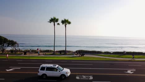 drone reveal from building to the beach