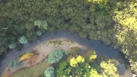 River-flowing-through-a-valley-in-mountain-foothills