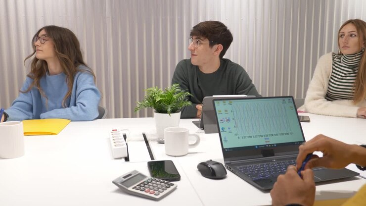 Young professionals collaborating on project in modern office